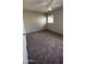 Spacious bedroom with ceiling fan and carpet flooring at 2945 N 19Th Ave # 67, Phoenix, AZ 85015