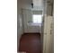 Bright kitchen with white cabinets and red tile floor at 2945 N 19Th Ave # 67, Phoenix, AZ 85015