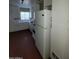 White kitchen with appliances and red tile floor at 2945 N 19Th Ave # 67, Phoenix, AZ 85015