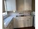 Bright kitchen features white cabinets and tile countertops at 2945 N 19Th Ave # 67, Phoenix, AZ 85015