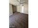 Bright living room with ceiling fan and carpeted floor at 2945 N 19Th Ave # 67, Phoenix, AZ 85015