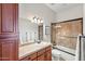 Clean bathroom with a shower/tub combo, vanity, and wood cabinets at 351 N Cloverfield Cir, Litchfield Park, AZ 85340