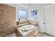 Bathroom with large soaking tub and tile surround at 351 N Cloverfield Cir, Litchfield Park, AZ 85340
