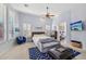 Main bedroom with sitting area, TV, and blue accents at 351 N Cloverfield Cir, Litchfield Park, AZ 85340