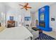 Main bedroom with fireplace, sitting area, and large windows at 351 N Cloverfield Cir, Litchfield Park, AZ 85340