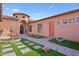 Inviting courtyard entry with fountain and brick walkways at 351 N Cloverfield Cir, Litchfield Park, AZ 85340