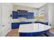 Gourmet kitchen with blue cabinetry and breakfast bar at 351 N Cloverfield Cir, Litchfield Park, AZ 85340