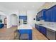 Modern kitchen with blue cabinetry and large island at 351 N Cloverfield Cir, Litchfield Park, AZ 85340