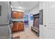 Laundry room with washer, dryer, cabinets, and built-in storage at 351 N Cloverfield Cir, Litchfield Park, AZ 85340