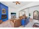 Spacious living room with fireplace and large windows at 351 N Cloverfield Cir, Litchfield Park, AZ 85340