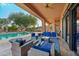Inviting pool area with patio furniture and lush landscaping at 351 N Cloverfield Cir, Litchfield Park, AZ 85340