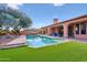 Sparkling pool and spa surrounded by a grassy yard at 351 N Cloverfield Cir, Litchfield Park, AZ 85340
