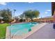 Inviting pool with spacious patio and lush landscaping at 351 N Cloverfield Cir, Litchfield Park, AZ 85340