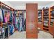 Large walk-in closet with ample shelving and hanging space at 351 N Cloverfield Cir, Litchfield Park, AZ 85340