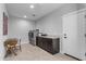 Laundry room with built-in cabinets and desk at 35372 N Sunset Trl, Queen Creek, AZ 85140