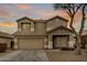 Two-story house with a large garage and landscaped yard at 45748 W Dirk St, Maricopa, AZ 85139