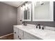 Modern bathroom with double vanity and marble countertops at 4731 W Continental Dr, Glendale, AZ 85308