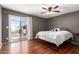 Bright bedroom with wood floors and access to a private balcony at 4731 W Continental Dr, Glendale, AZ 85308