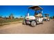 Golf carts parked on paved path near clubhouse at 4731 W Continental Dr, Glendale, AZ 85308