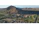 Aerial view of community near mountain, golf course, and resort at 5000 E Camelback Ridge Rd # 407, Scottsdale, AZ 85251