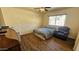 Bedroom with hardwood floors, a large window and ceiling fan at 538 S Meridian Rd, Apache Junction, AZ 85120