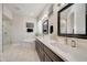 Bathroom with double vanity and soaking tub at 6213 W Saguaro Park Ln, Glendale, AZ 85310