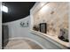 Modern wine cellar with tile walls and a wine fridge at 6213 W Saguaro Park Ln, Glendale, AZ 85310