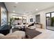 Living room with comfortable seating, large windows, and modern art at 6609 E 4Th St, Scottsdale, AZ 85251