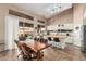 Kitchen features white cabinets, butcher block countertops, and sliding door to backyard at 6872 W Linda Ln, Chandler, AZ 85226