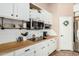 Bright kitchen with butcher block countertops and stainless steel appliances at 6872 W Linda Ln, Chandler, AZ 85226