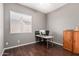 Home office with wood desk and window at 6872 W Linda Ln, Chandler, AZ 85226