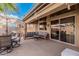 Relaxing outdoor patio with seating area, umbrella, and grill at 6872 W Linda Ln, Chandler, AZ 85226