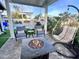 Relaxing backyard with a fire pit, pool, and patio furniture at 8114 E Clarendon Ave, Scottsdale, AZ 85251