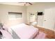 Bright bedroom with hardwood floors and a mirrored closet at 8114 E Clarendon Ave, Scottsdale, AZ 85251