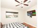 Comfortable bedroom with a large window and hardwood floors at 8114 E Clarendon Ave, Scottsdale, AZ 85251
