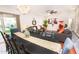Open concept dining room with seating for eight and backyard view at 8114 E Clarendon Ave, Scottsdale, AZ 85251