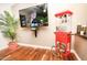 Home entertainment area with large TV and vintage popcorn machine at 8114 E Clarendon Ave, Scottsdale, AZ 85251