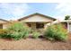 Charming curb appeal with a covered porch and well-manicured landscaping at 8114 E Clarendon Ave, Scottsdale, AZ 85251