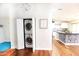 Updated laundry closet with stackable washer and dryer in kitchen at 8114 E Clarendon Ave, Scottsdale, AZ 85251