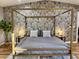 Luxurious main bedroom with a stunning canopy bed and beautiful wallpaper at 8114 E Clarendon Ave, Scottsdale, AZ 85251