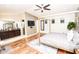 Main bedroom with hardwood floors and en-suite bathroom at 8114 E Clarendon Ave, Scottsdale, AZ 85251