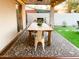 Outdoor patio with dining table and grill at 8114 E Clarendon Ave, Scottsdale, AZ 85251