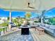 Covered patio with fire pit and seating area at 8114 E Clarendon Ave, Scottsdale, AZ 85251