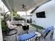 Covered patio with comfortable seating and fire pit at 8114 E Clarendon Ave, Scottsdale, AZ 85251