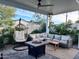 Relaxing patio with fire pit and hanging chair at 8114 E Clarendon Ave, Scottsdale, AZ 85251