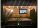 Charming covered patio with string lights, creating a magical ambiance at night at 8114 E Clarendon Ave, Scottsdale, AZ 85251