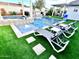 Luxury pool and spa with artificial turf and lounge chairs at 8114 E Clarendon Ave, Scottsdale, AZ 85251
