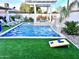 Stunning pool with a waterfall feature and pergola at 8114 E Clarendon Ave, Scottsdale, AZ 85251