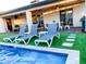 Relaxing backyard oasis with a sparkling pool and comfortable lounge chairs at 8114 E Clarendon Ave, Scottsdale, AZ 85251