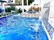Refreshing pool with waterfall, spa, and lounge chairs at 8114 E Clarendon Ave, Scottsdale, AZ 85251